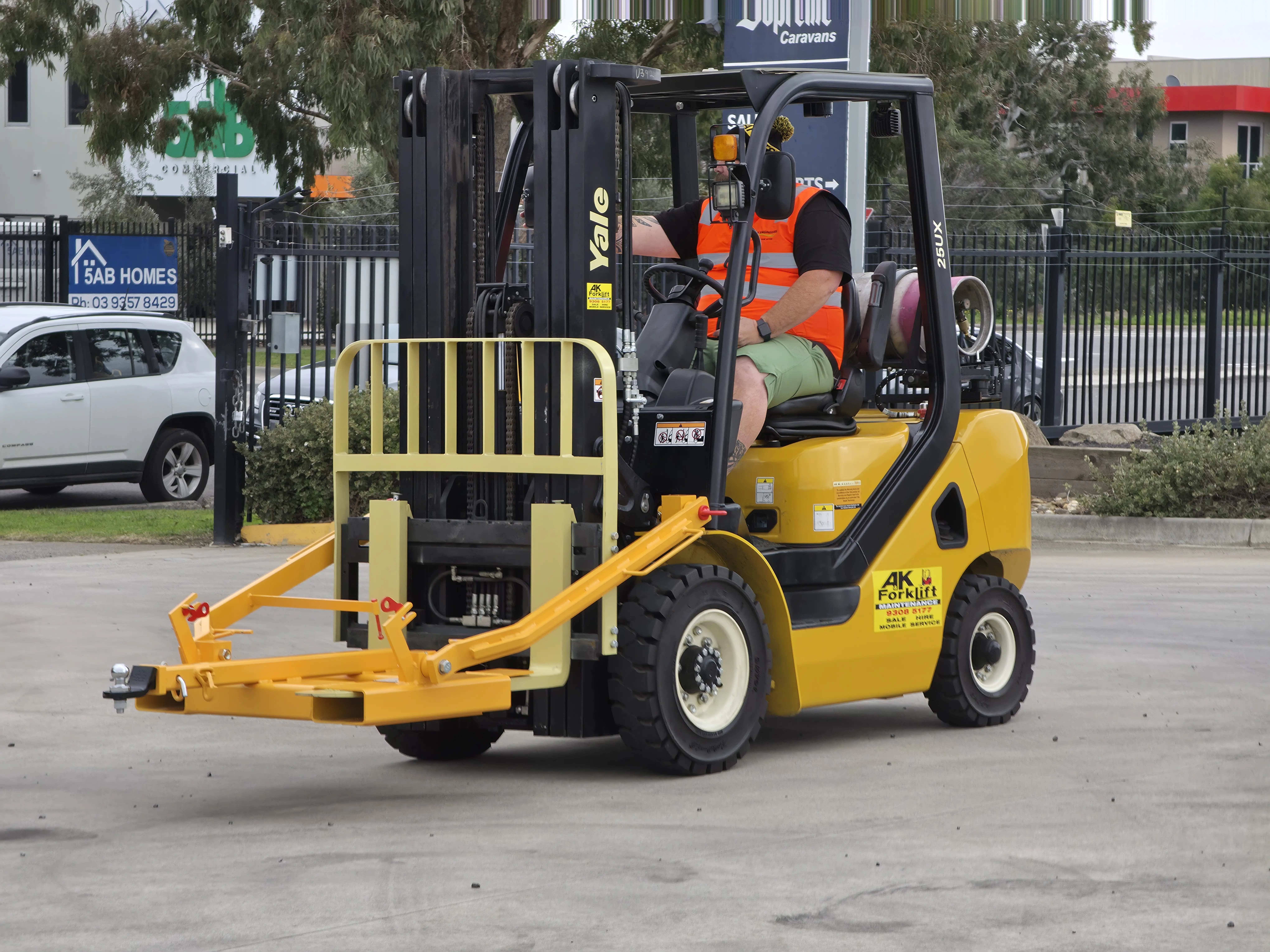 Forklift attachment in warehouse